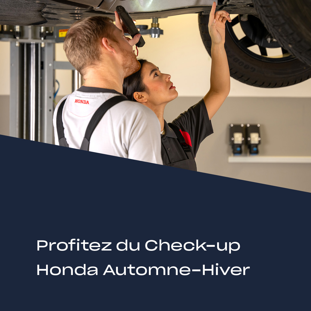 Techniciens Honda effectuant le Check-up Automne-Hiver au Garage Majestic SA &agrave; La Tour-de-Tr&ecirc;me, sp&eacute;cialiste entretien Honda.